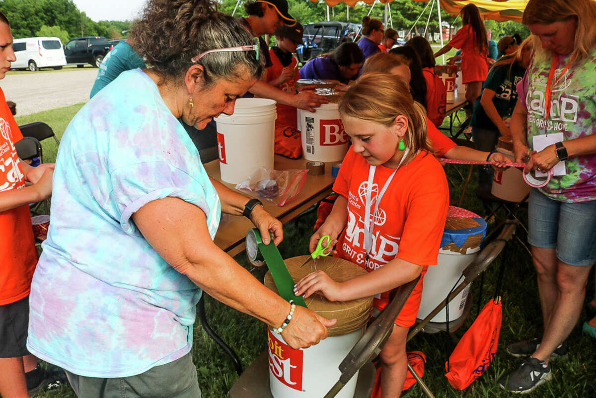 Children, caregivers, volunteers, and adults participate in Camp Grief, Grit and Hope, hosted by Children's Grief Center of the Great Lakes Bay Region, on June 12, 2021 at the Lazy Turtle Ranch in Sanford. (Aurora Abraham/aurora.abraham@hearstnp.com)