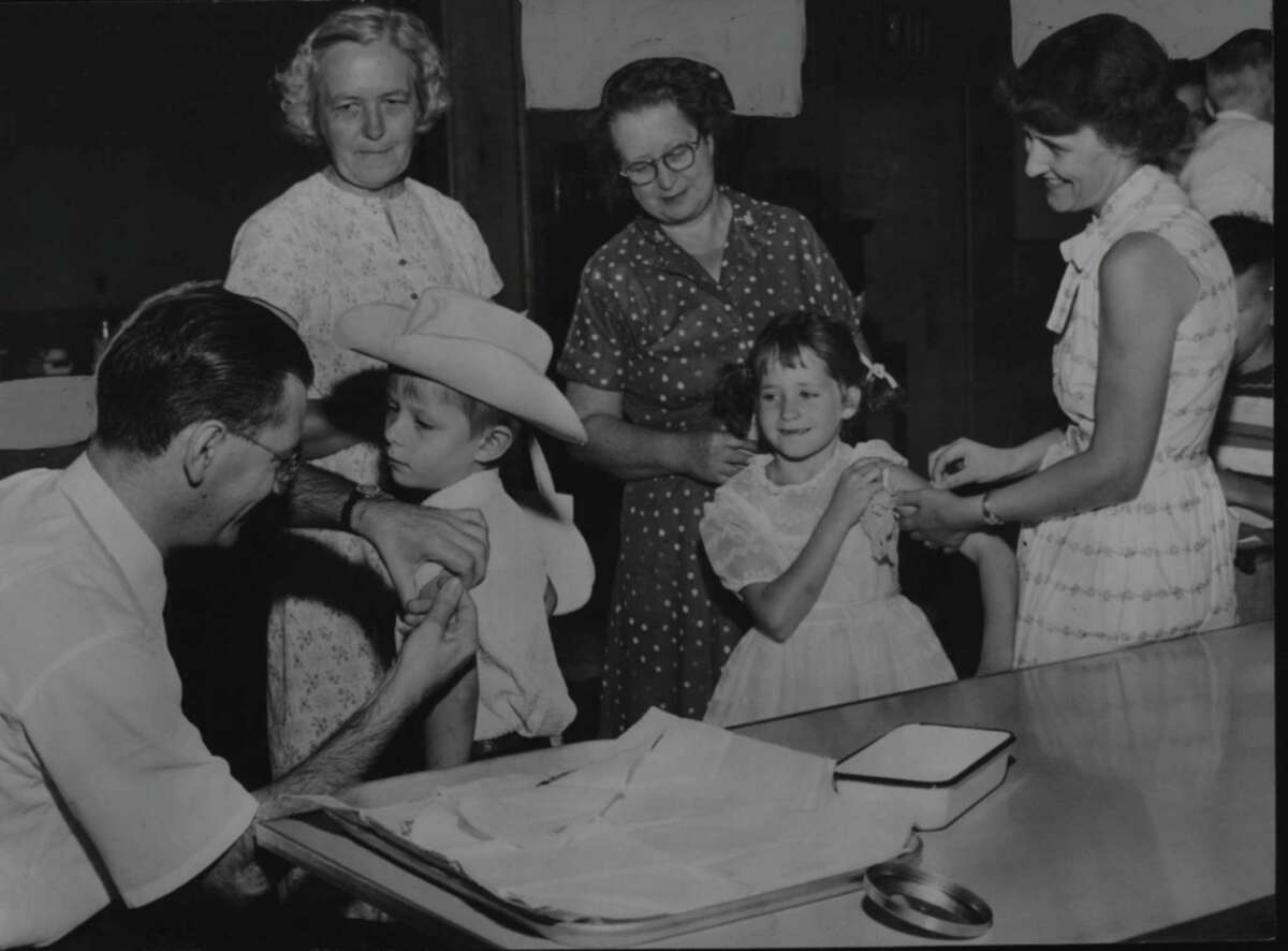 Dr. Marvin Palandsy gives polio vaccinations in Colonie, New York. August 08, 1955 (Times Union Archive)