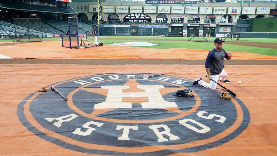 Houston Astros bench coach Joe Espada on the Astros logo during batting practice before the start of an MLB baseball game at Minute Maid Park, Tuesday, June 15, 2021, in Houston.