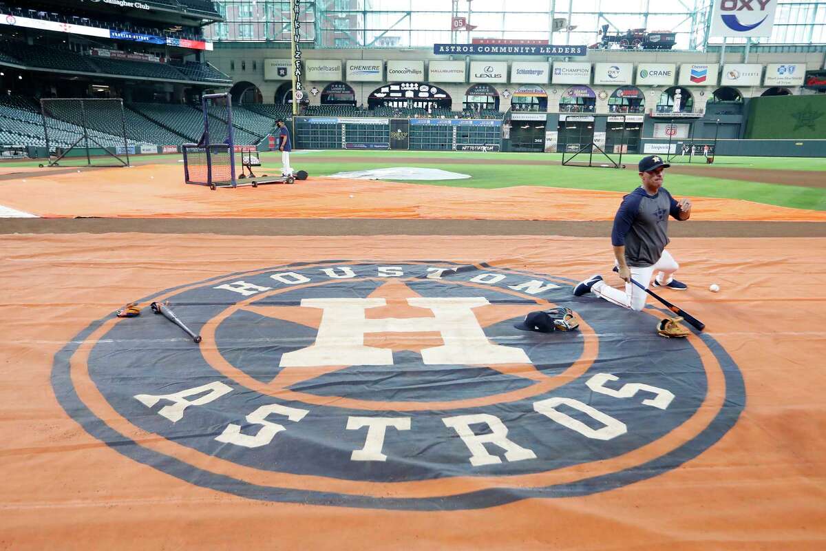 Houston Astros bench coach Joe Espada on the Astros logo during batting practice before the start of an MLB baseball game at Minute Maid Park, Tuesday, June 15, 2021, in Houston.