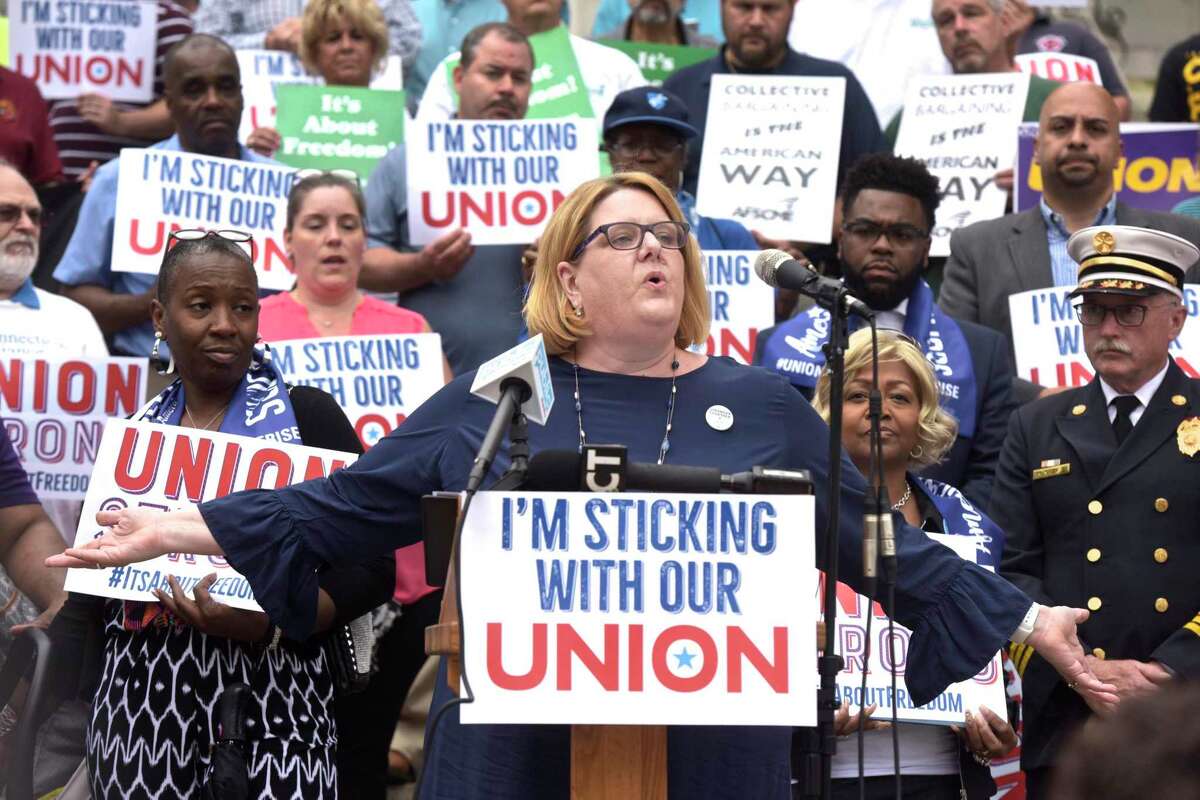 Kate Dias speaks during an press conference by workers and labor leaders on the steps of the Connecticut Supreme Court in response to the U.S. Supreme Court on Janus v. AFSCME Council case on June 27, 2018, in Hartford, Conn.