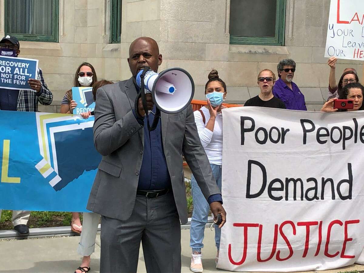 The Rev. Rodney Wade, pastor of the Long Hill Bible Church in Waterbury, speaks during a rally of faith and labor leaders outside of the Capitol earlier this month