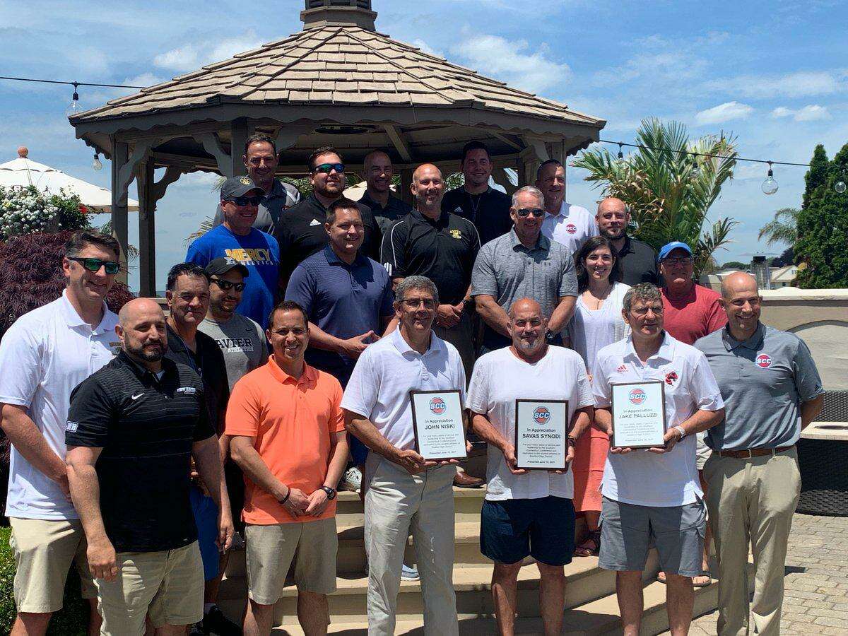 Shelton’s John Niski (fourth from right in front row) is feted by Southern Connecticut Conference athletic directors.