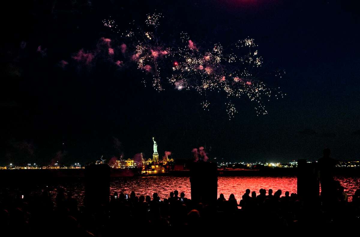 Fireworks explode over New York Harbor and the Statue of Liberty as New York and other cities around New York state recognize a rate of 70% for single dose vaccinations against the COVID-19 virus, Tuesday, June 15, 2021 in New York. Celebration of the milestone was announced by Gov. Andrew Cuomo earlier in the day.