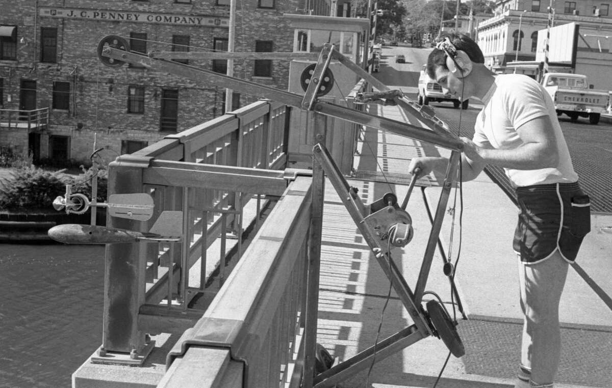 The fellow with the odd-looking apparatus seen on the Maple Street Bridge this morning was Don James of the United States Geological Survey Service, who was taking the monthly water flow measurement and water sampling from the river. The photo was published in the News Advocate on June 17, 1981. (Manistee County Historical Museum photo)