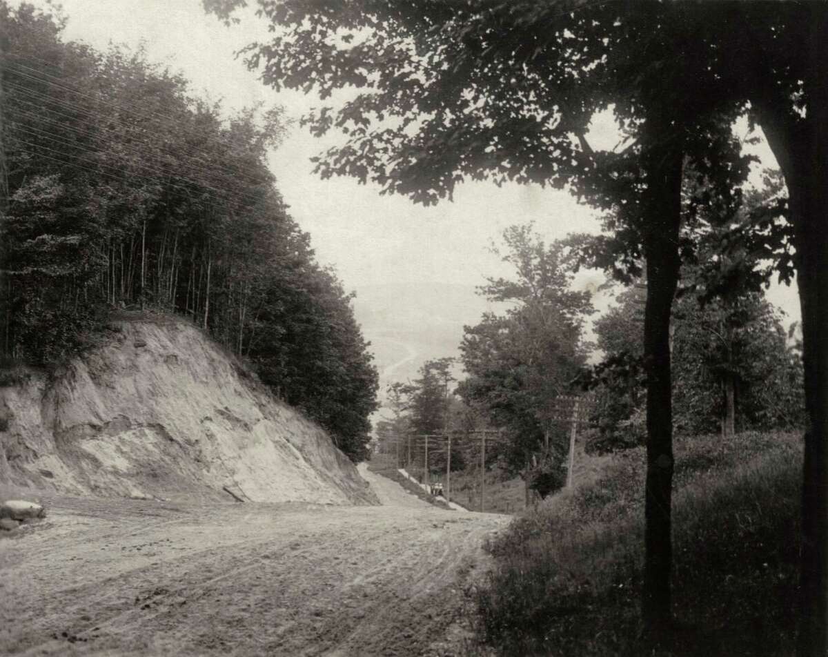 The Beulah/Benzonia hill about 1920, showing the cut made to lessen the steepness, although good brakes still a necessity. (Courtesy photo)