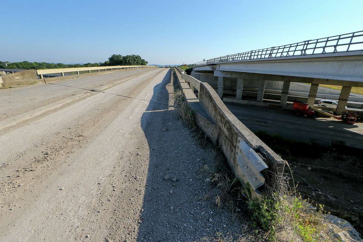 The highway bridge at Interstate 10 and Old Highway 87, left, known as the Main Street Bridge in Boerne, on Wednesday. Demolition of the bridge has been delayed for a few more weeks because nests of cliff swallows, a migratory bird, have been found underneath.