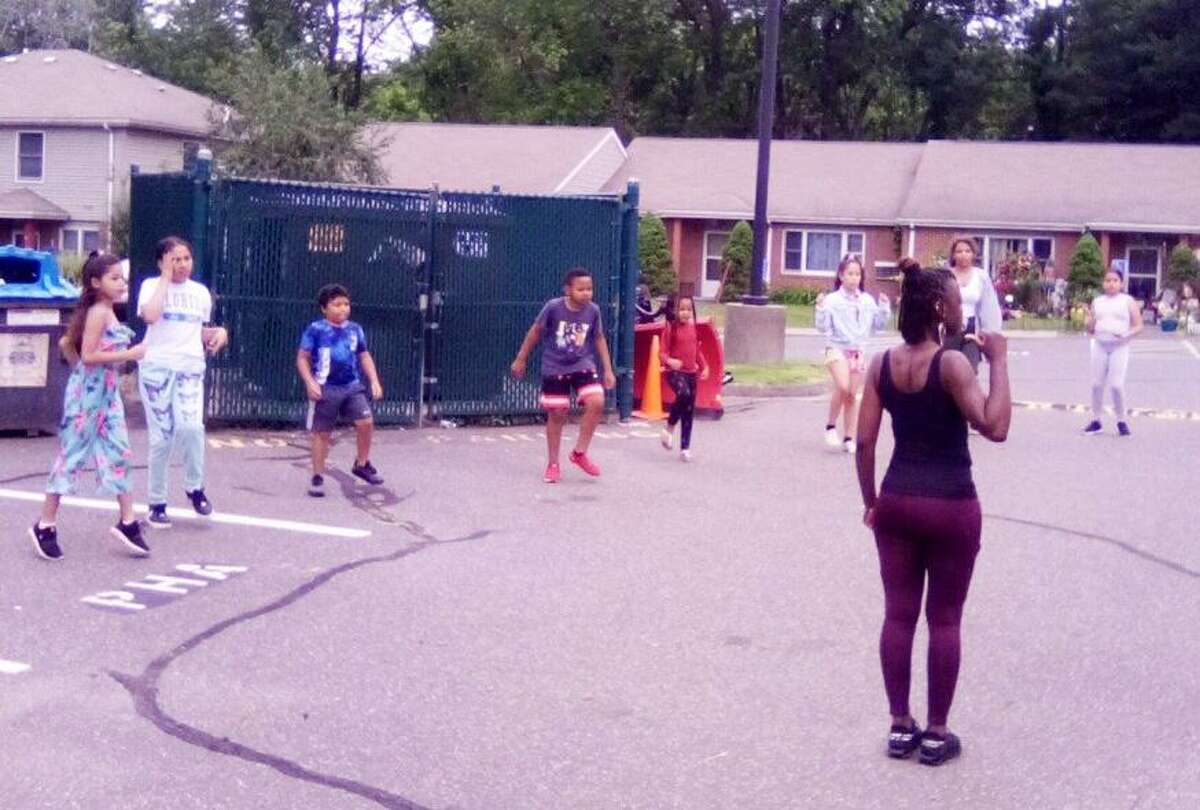 Shanay Fulton and Tanjah Thompson of Middletown are leading “Summer Saturdays,” an afternoon youth dance troupe at the Chatham Court housing project in Portland. The effort, funded by a $1,500 Portland Youth Services grant, is administered by Oddfellows Youth Playhouse in Middletown.