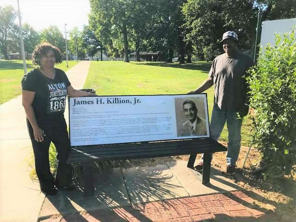 Alton Juneteenth Celebration committee member Marquato Rattler, left, and chairman Lee Barham, both of Alton, stand beside the namesake bench at James H. Killion Park at Salu in Alton. The 31st annual Juneteenth Celebration of Freedom is planned 11 a.m. to 5 p.m. Saturday, June 18, at the park.