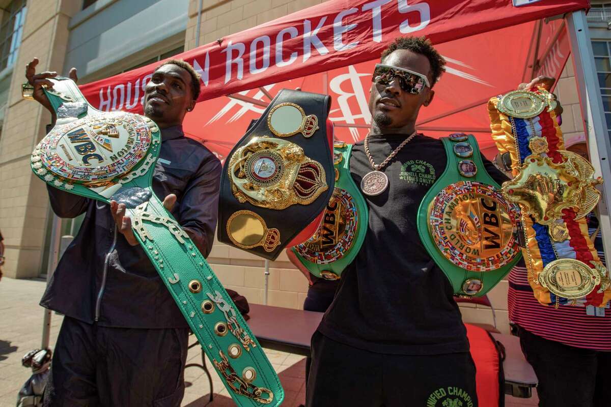 Jermall and Jermell Charlo show off their championship belts outside Toyota Center on Wednesday, June 16, 2021.