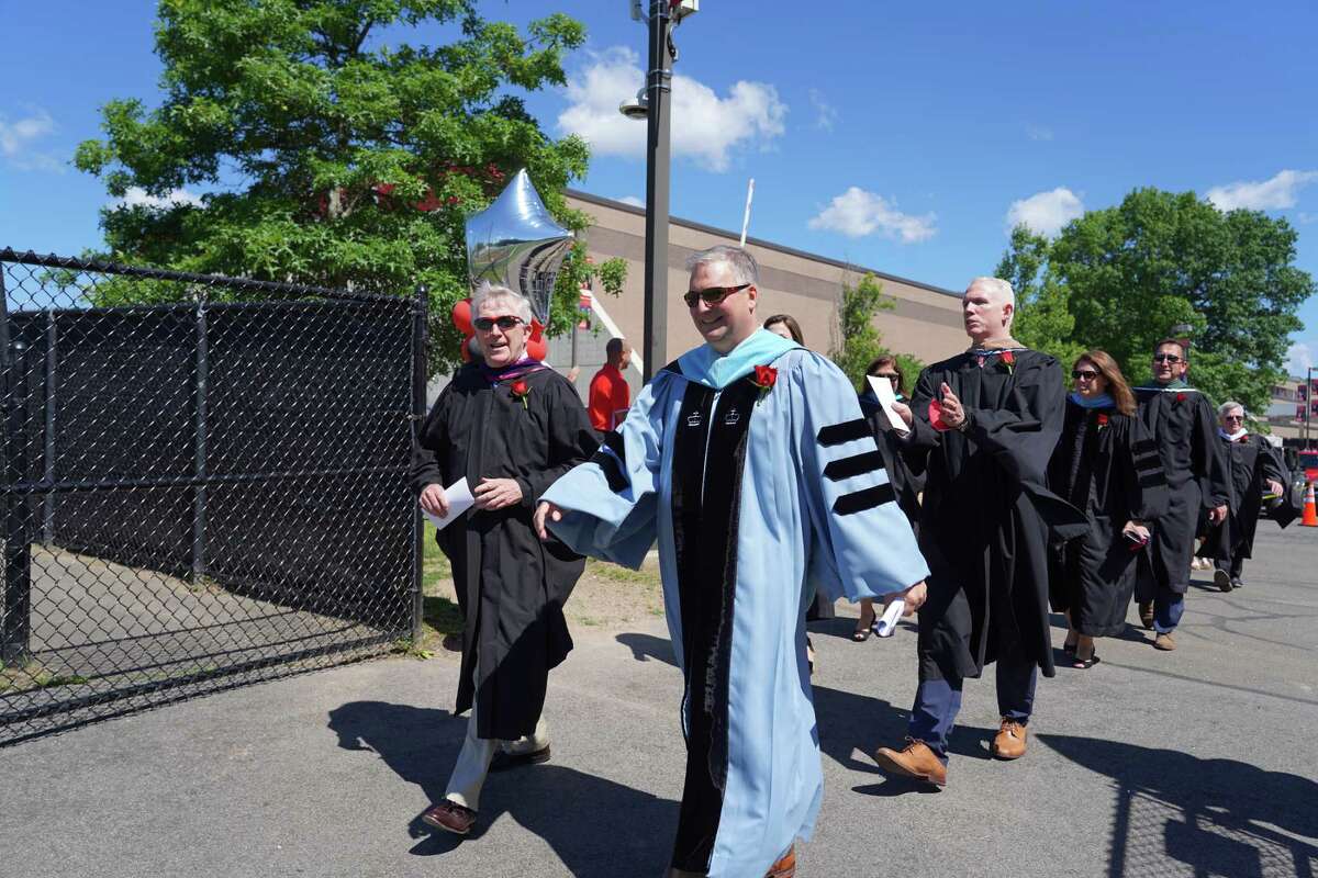 First Selectman Kevin Moynihan, left, and Superintendent Bryan Luizzi led the procession into the graduation for the Class of 2021 on June 16. New Canaan Principal William Egan followed close behind Luizzi.