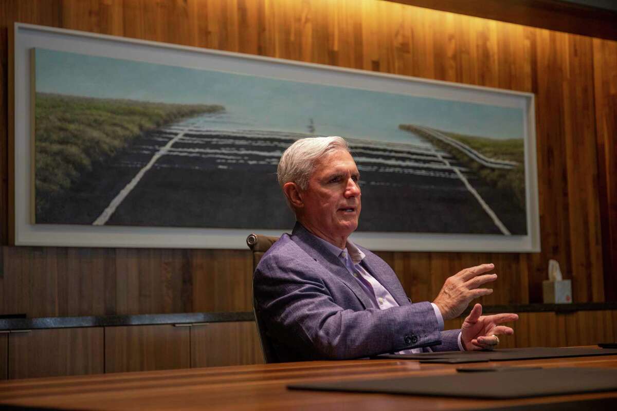 Tim Leach, executive vice president of ConocoPhillips, talks about education and healthcare in Midland in front of a Woody Gwyn painting Wednesday, June 9, 2021 at ConocoPhillips. Jacy Lewis/Reporter-Telegram