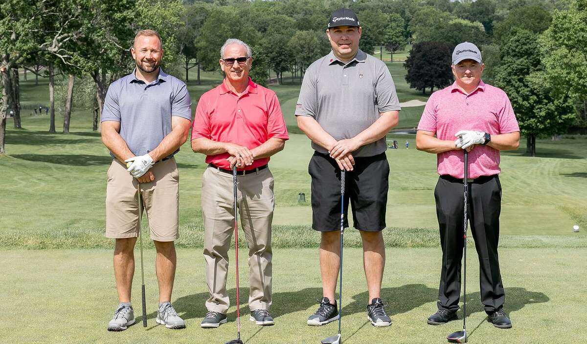Toby Giangrande of Shelton, Eric D’Eramo of Stratford, Rob Janczewski of Trumbull and Dustin Tilford of New Milford get set to tee off at Wee Burn Country Club.