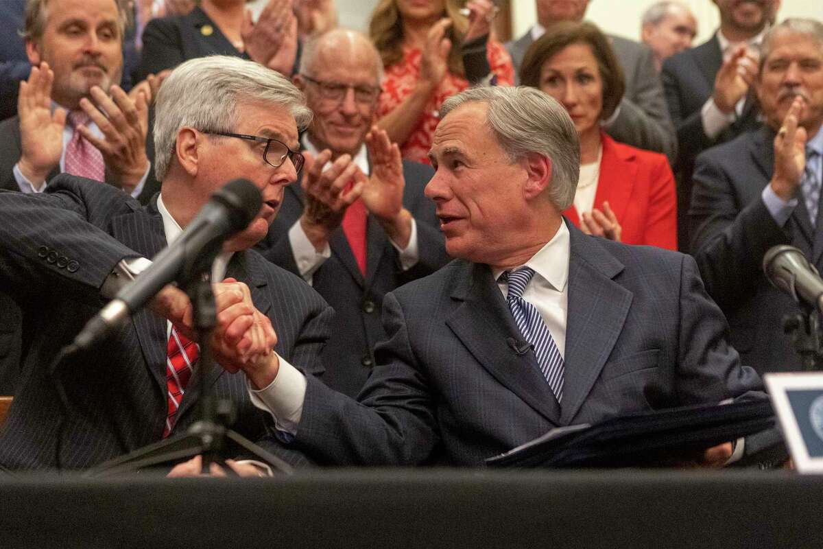 Lt. Governor Dan Patrick, left, and Gov. Greg Abbott announce a plan for Texas to add new fencing along the Mexican border during a press at the Texas State Capitol, Wednesday, June 16, 2021. (Stephen Spillman / for Express-News)