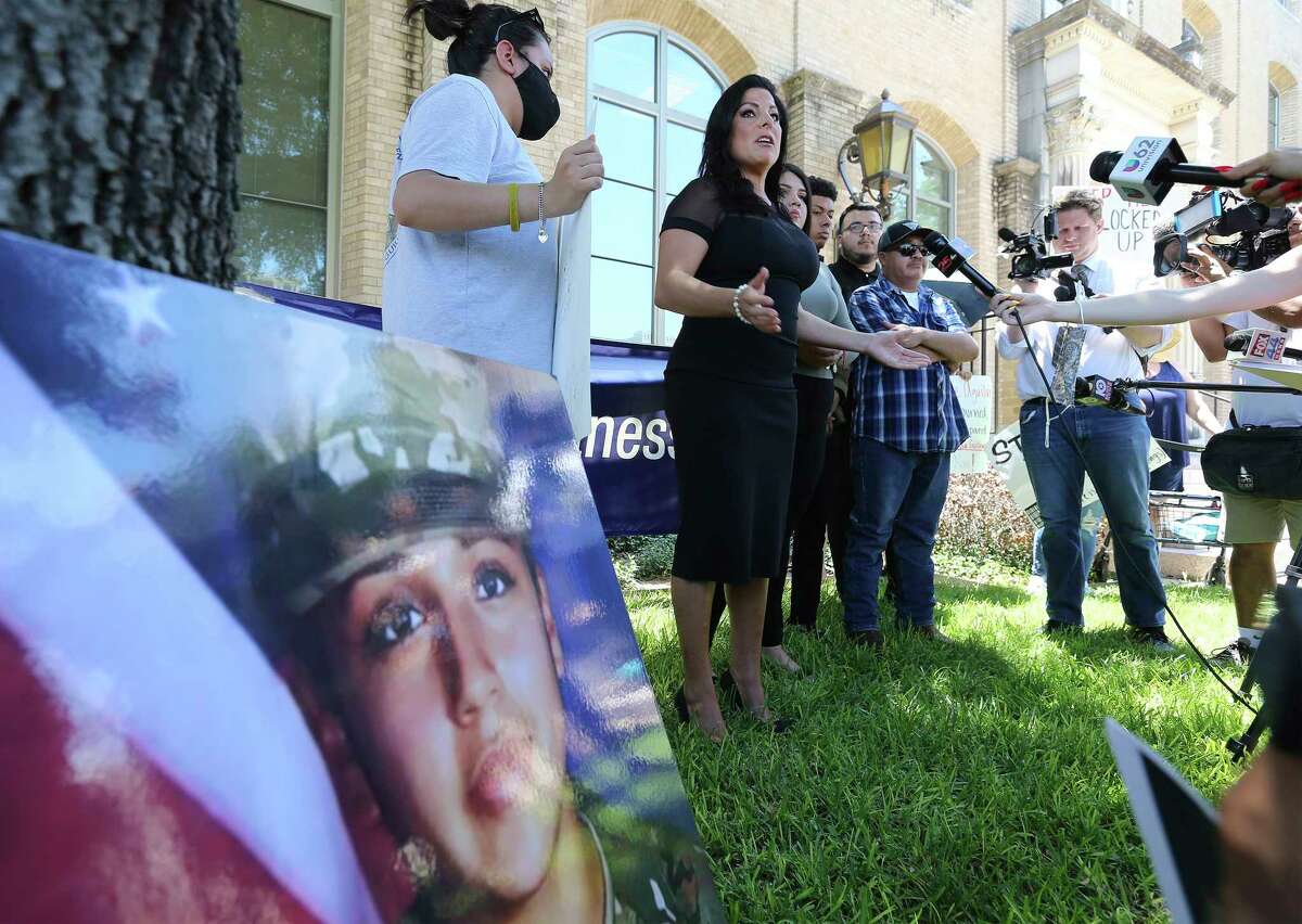 Attorney Natalie Khawam (center) addresses the media before a hearing as family and supporters of slain Army Spc. Vanessa Guillén appear at a hearing in Waco, Texas on Wednesday, June 16, 2021 for Cecily Aguilar, the girlfriend of Guillén's suspected killer, who asked a judge to suppress her confession to police that she helped hide the late Houston soldier's body after her boyfriend bludgeoned her to death. A judge rejected her motion to suppress evidence of her police statement from a potential jury. She also has a pending motion to dismiss the entire indictment. While the hearing was underway, family members and supporters stood outside the courthouse and chanted for justice for Guillén .