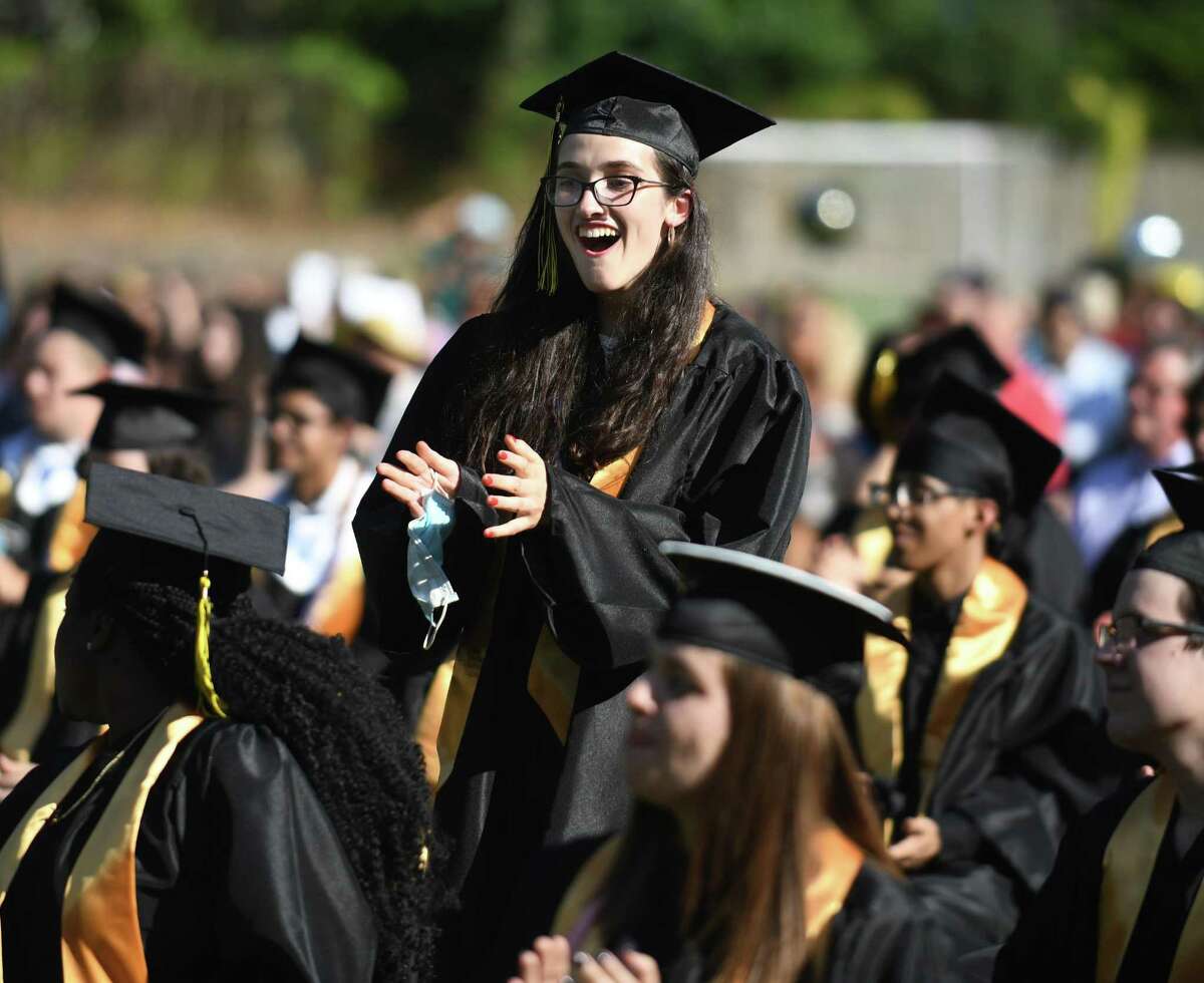 Dorothea Johnson applauds her classmates during the Academy of Information Technology & Engineering (AITE) 2020-2021 commencement ceremony at the AITE campus in Stamford, Conn. Wednesday, June 16, 2021.