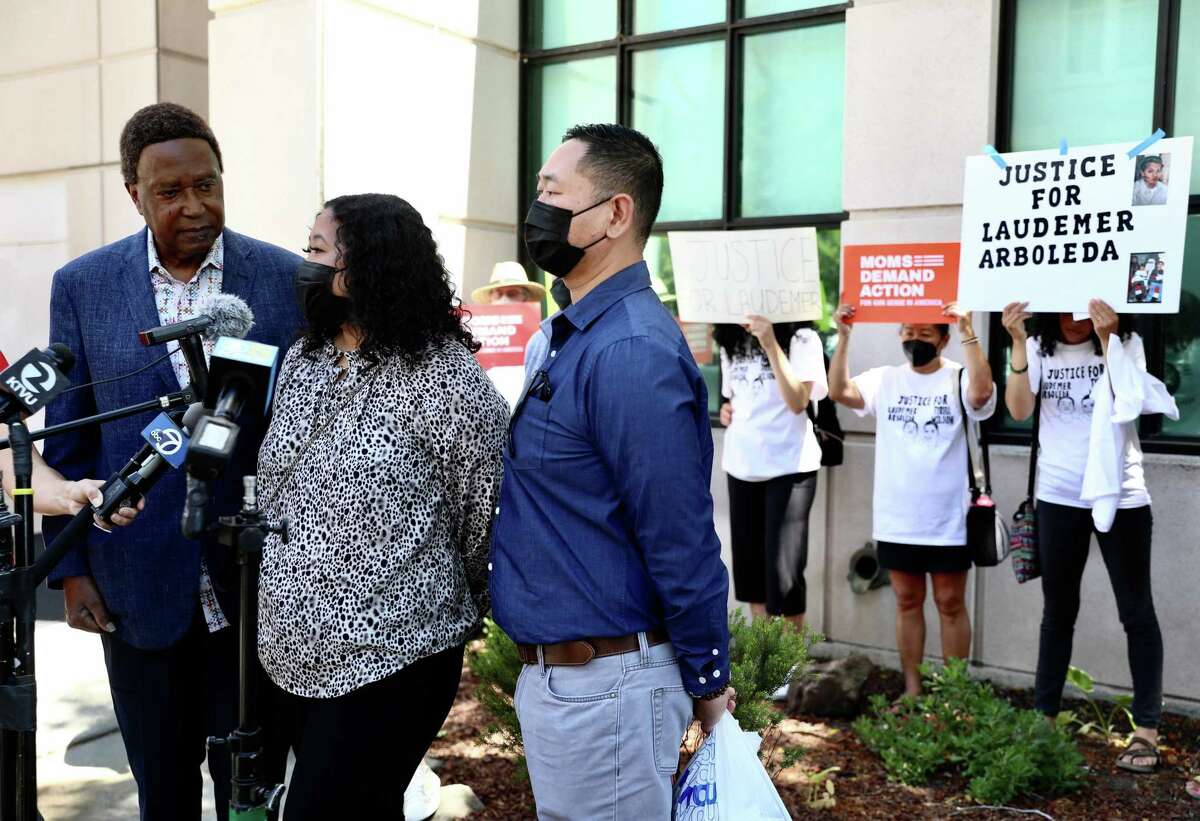 John Burris, left, a civil attorney representing Tyrell Wilson's family, stands beside Jessica Leong, Laudemer Arboleda's niece, and her father, Lester Leong, Arboleda's brother-in-law, outside the A.F. Bray Courthouse following an arraignment hearing for Danville police Officer Andrew Hall on Wednesday, June 16, 2021, in Martinez, Calif. 