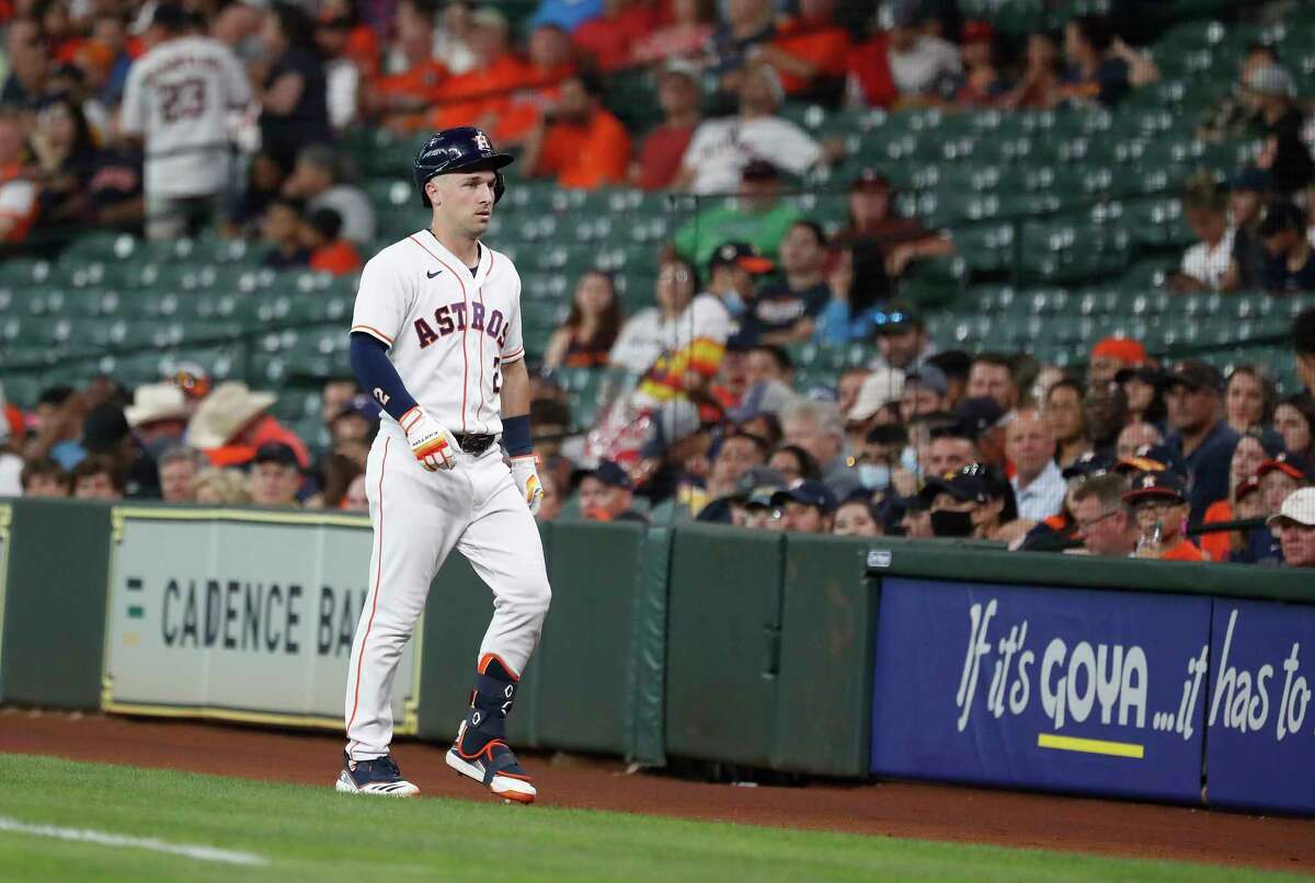 Astros third baseman Alex Bregman limps back to the dugout after grounding into a double play during the first inning of Wednesday's game against the Rangers at Minute Maid Park.