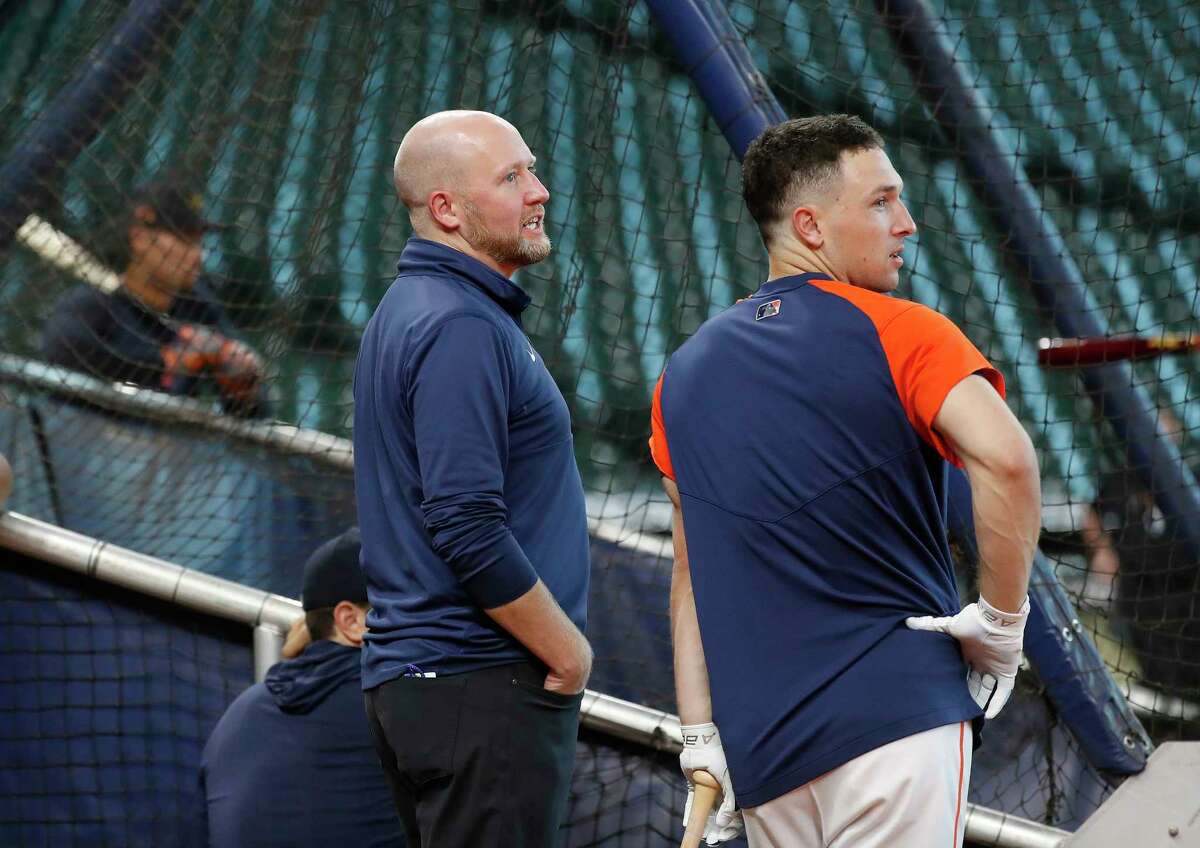 Houston Astros GM James Click chats with Alex Bregman during batting practice before the start of an MLB baseball game at Minute Maid Park, Wednesday, June 16, 2021.