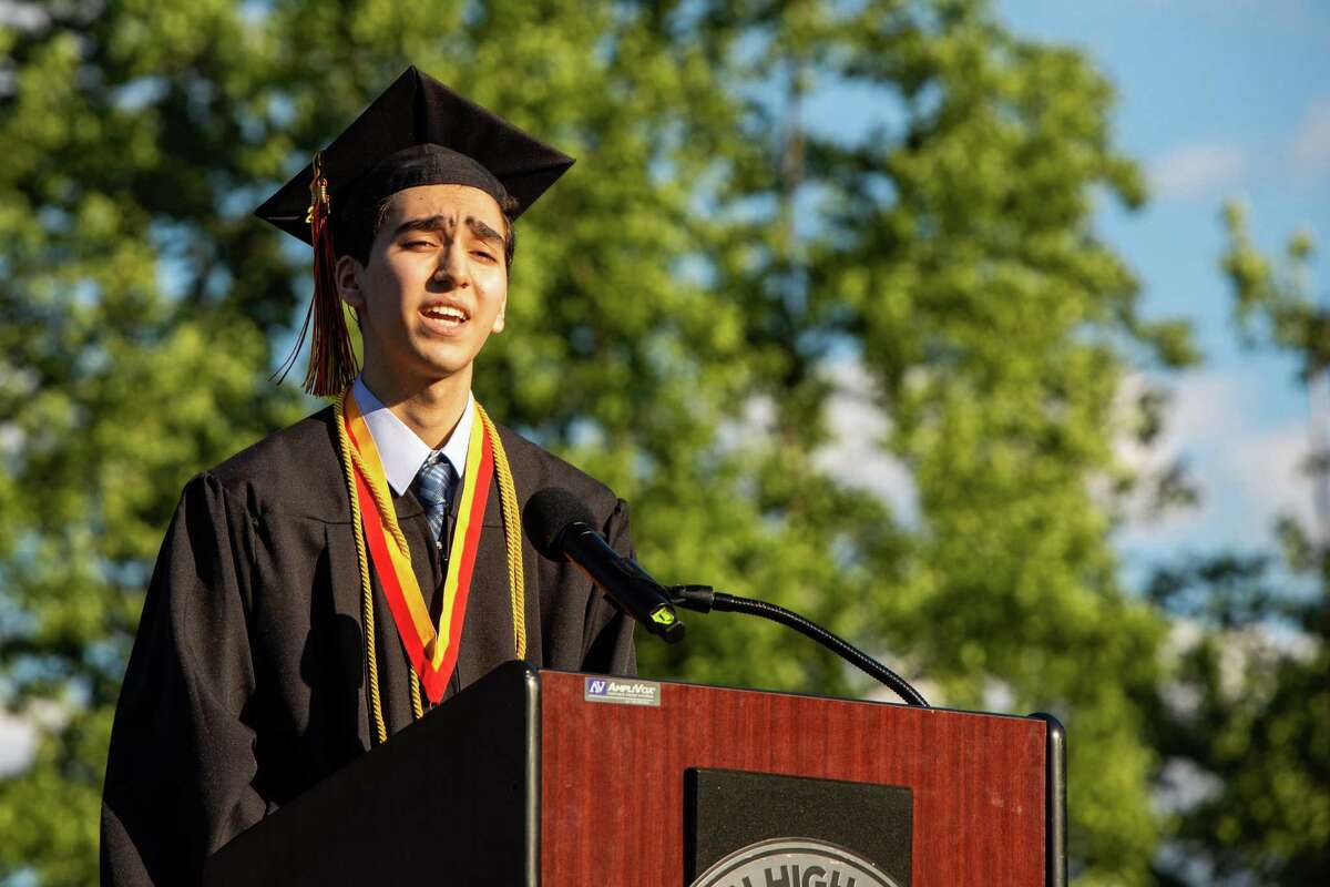 Shelton High School Valedictorian Majd Saymeh addresses the audience at Finn Stadium during graduation for the Class of 2021 on June 16, 2021.