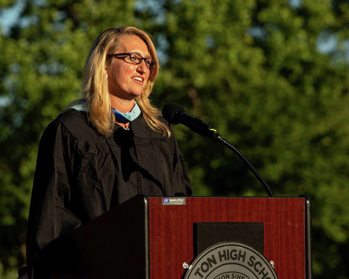 Shelton High School Principal Kathleen Riddle addresses the audience at Finn Stadium during graduation for the Class of 2021 on June 16, 2021.