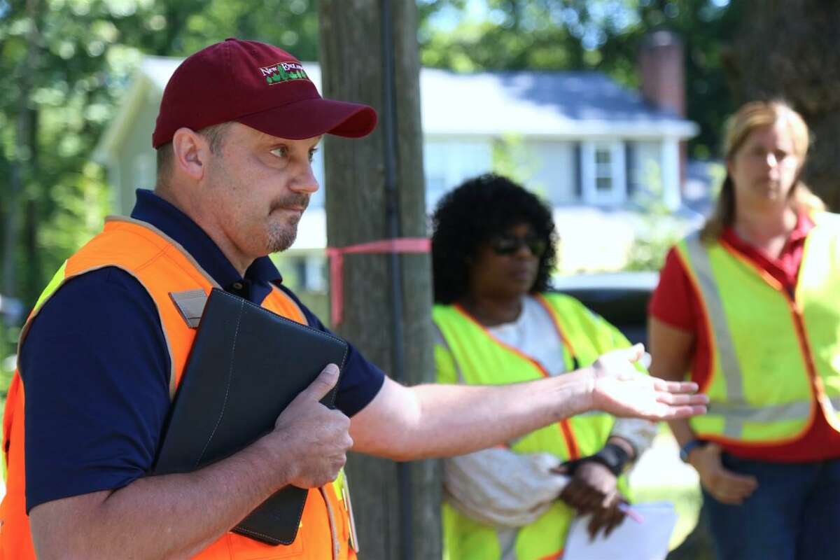 File photo of Sean Redding, manager of vegetation management with Eversource, explaining the dangers of arcing and why the utility had to do emergency tree pruning in Darien.