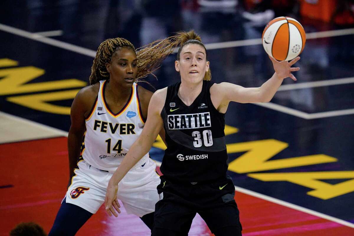 Seattle Storm forward Breanna Stewart gets a pass in front of Indiana Fever's Jantel Lavender during the first half of a WNBA basketball game in Indianapolis, Tuesday, June 15, 2021.
