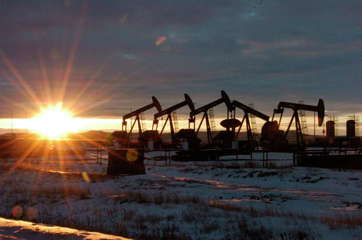 This Jan. 14, 2015 file photo shows oil pump jacks in McKenzie County in western North Dakota.
