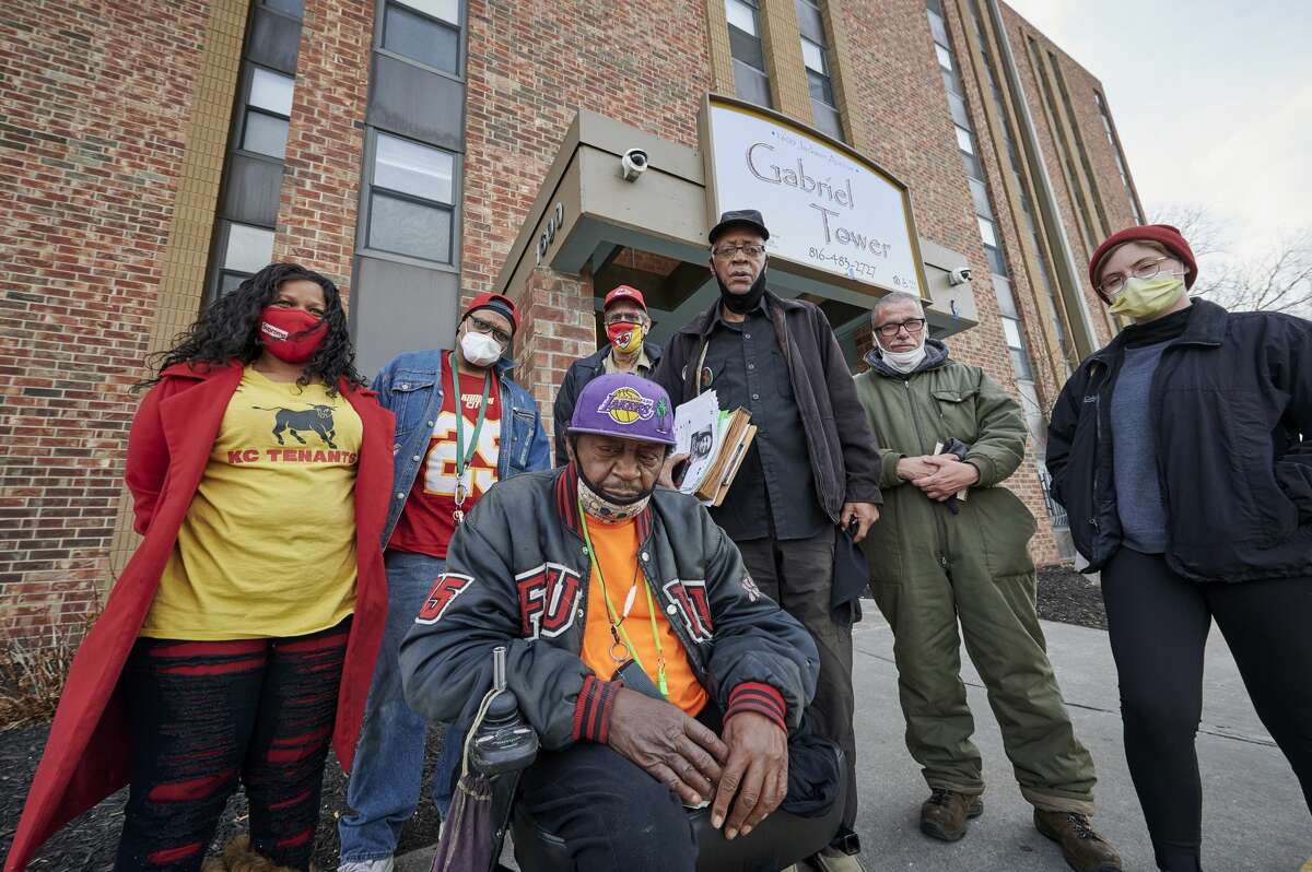 Aggrieved residents of Gabriel Tower Apartments and advocates from KC Tenants are pictured in front of Gabriel Tower Apartments on Jan. 19, 2021. In front is Rick Loker, a resident of the apartments for the past 2.5 years. Back row from left: Tiana Caldwell of KC Tenants; Trent Tyler, a four-year-resident; Jack Sisson, a resident for 7.5 years; Ronald McMillan, a resident for six years; Donnie DeBarge, a resident for 2.5 months; and Wilson Vance of KC Tenants.