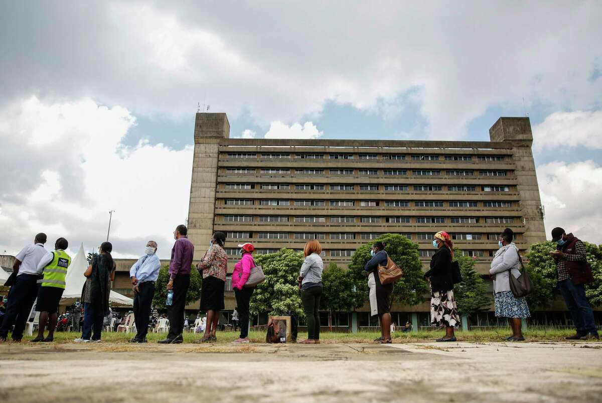 Kenyans line up to receive a dose of the AstraZeneca COVID-19 vaccine manufactured by the Serum Institute of India and provided through the global COVAX initiative, at Kenyatta National Hospital in Nairobi.