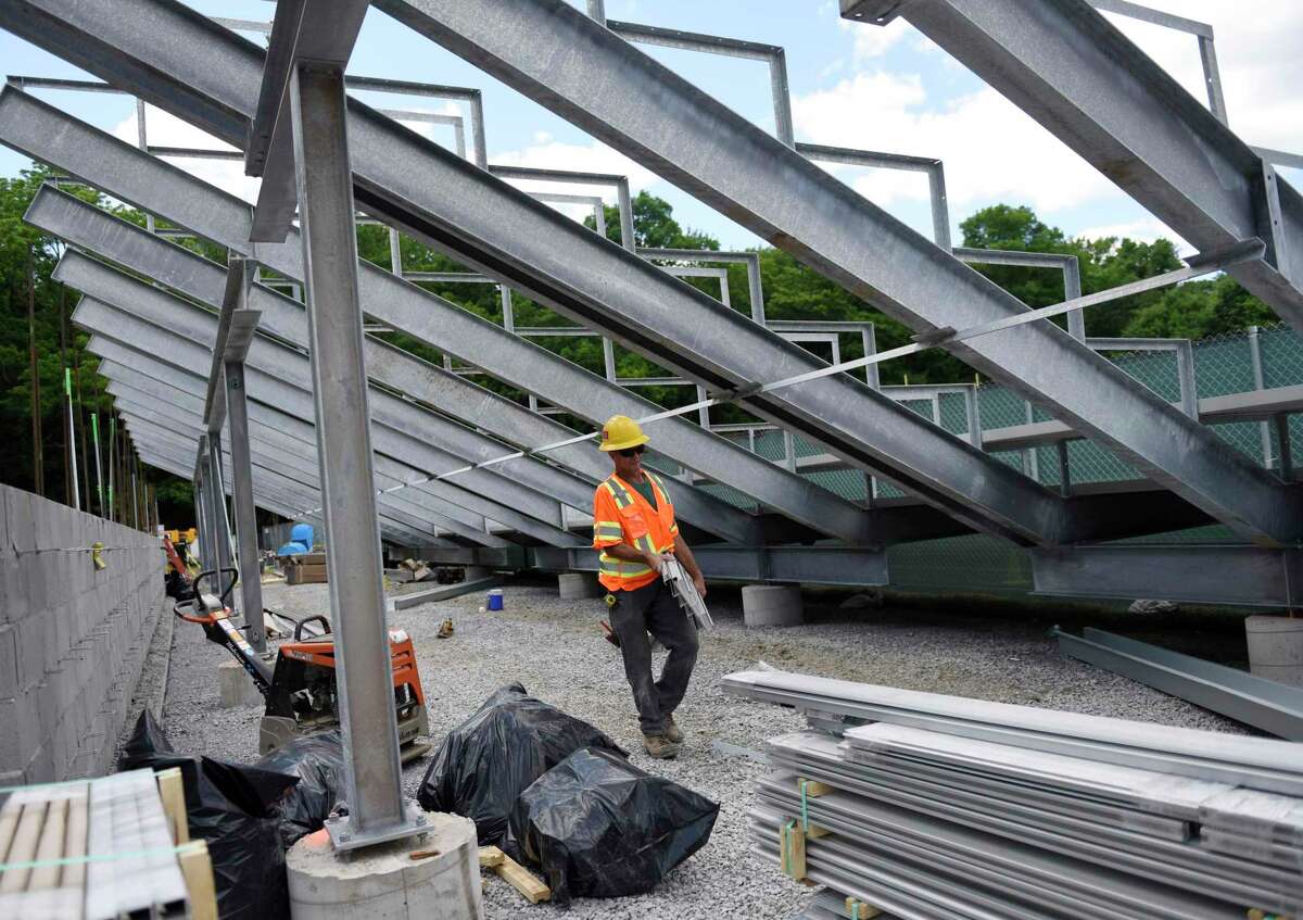 A worker builds new bleachers at Greenwich High School in Greenwich, Conn. Construction has seen the biggest rebound in employment of any major industry in Connecticut, according to updated figures this week from the Connecticut Department of Labor breaking out unemployment claims by varying sectors.