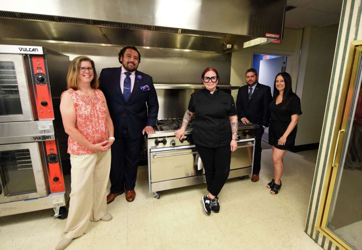 Feed Albany founders and staff; Christine O?•Neil, volunteer coordinator, left, Dominick Purnomo, co-founder, Shannon Dowen-Ronda, chef, Matthew T. Peter, president and co-founder, and Francesca Pardi, executive director, right, are pictured in the kitchen at the organization's new kitchen and headquarters on Friday, June 18, 2021, on Sheridan Avenue in Albany, N.Y. (Will Waldron/Times Union)