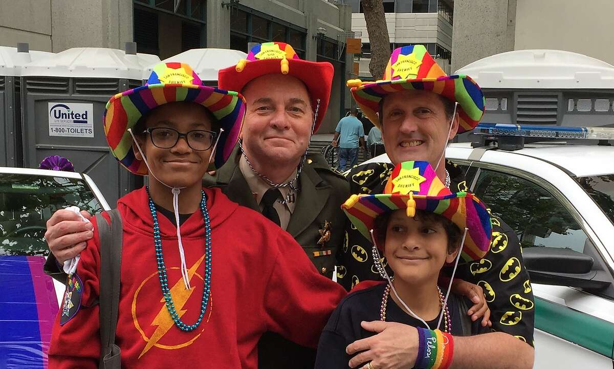 The Fisher-Paulson family poses together during the San Francisco Pride Parade in 2017.
