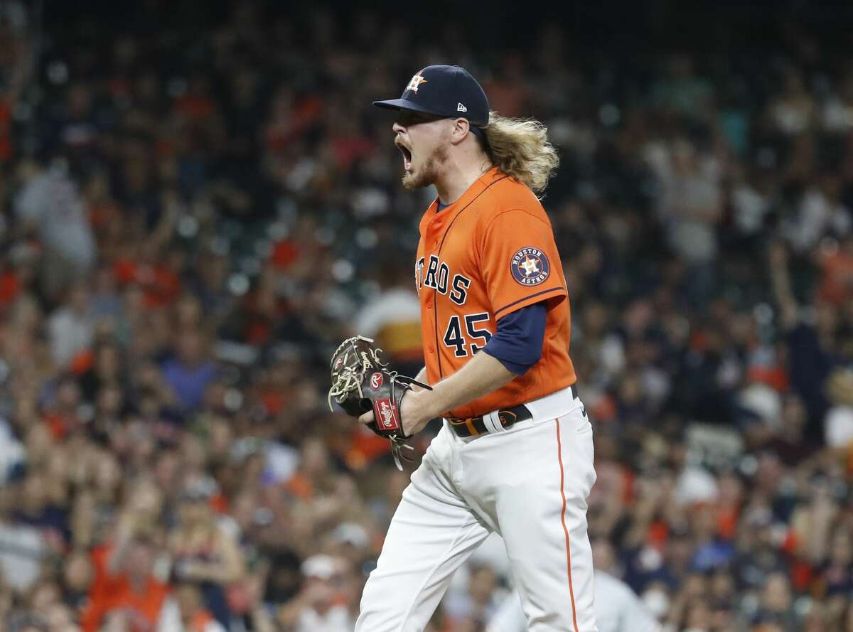 Houston Astros relief pitcher Ryne Stanek (45) reacts after striking out Chicago White Sox Jake Lamb to end the top of the eighth inning of an MLB baseball game at Minute Maid Park, Friday, June 18, 2021.