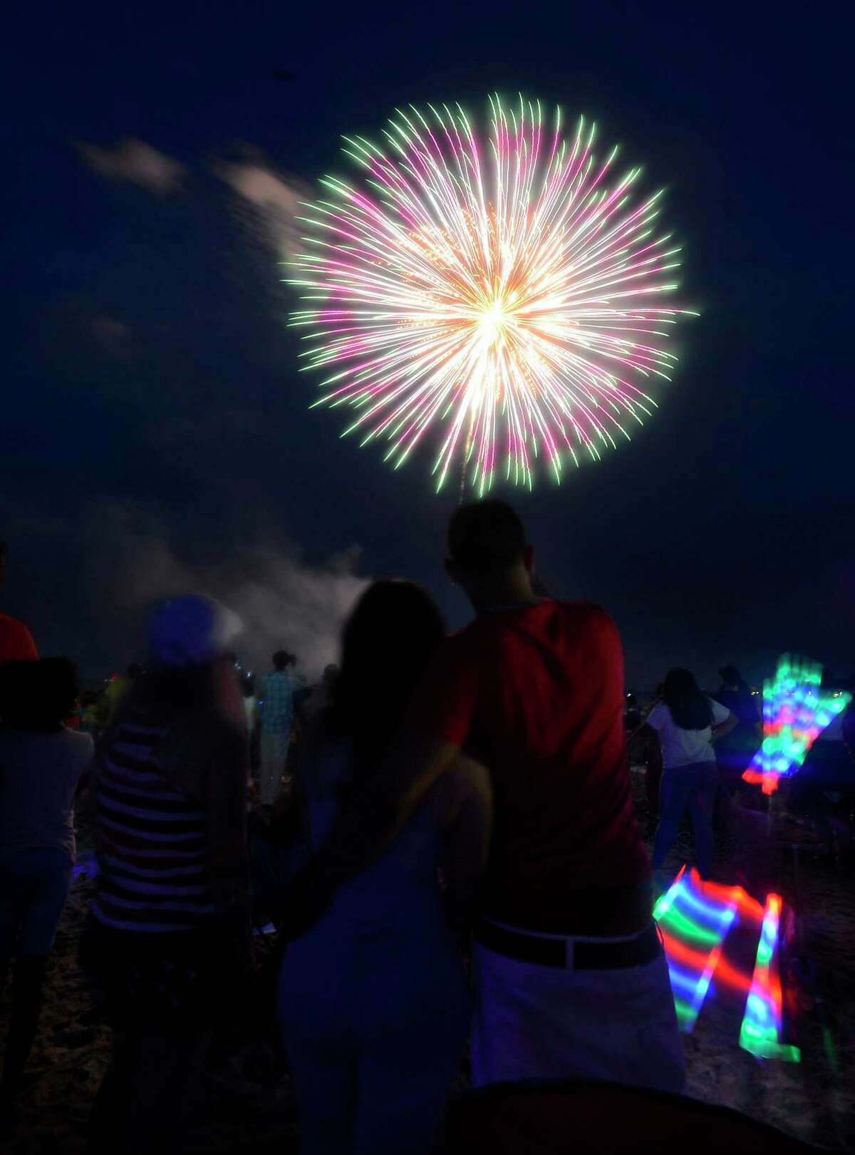 A fireworks spectacular lights up the skies over Cummings Park and Beach on Thursday, June 30, 2017 in Stamford, Connecticut. Several thousand residents weather a passing storm to take in the 20 minute show, enjoying a musical tribute, as they kick off their holiday weekend.