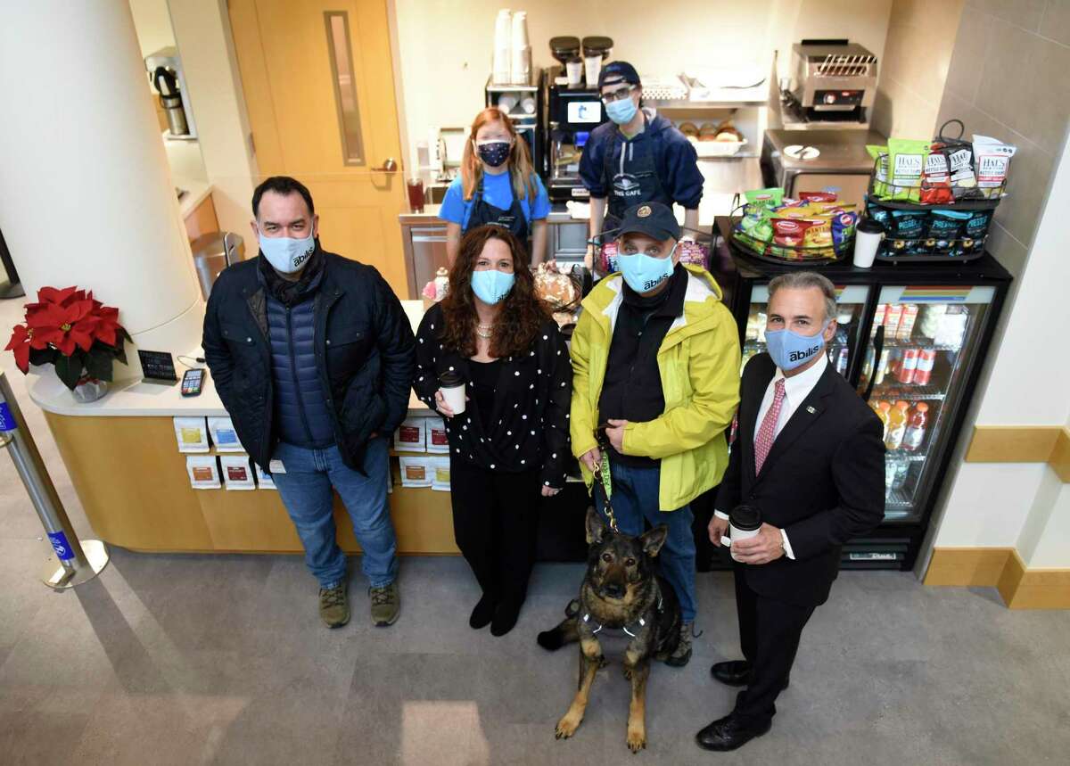 Folks pose together at the opening of the new Cafe at Greenwich Library on Dec. 14, 2020. The cafe is a partnership between the library and Abilis to provide employment for young adults with special needs. Abilis plans to open a similar one in Darien.