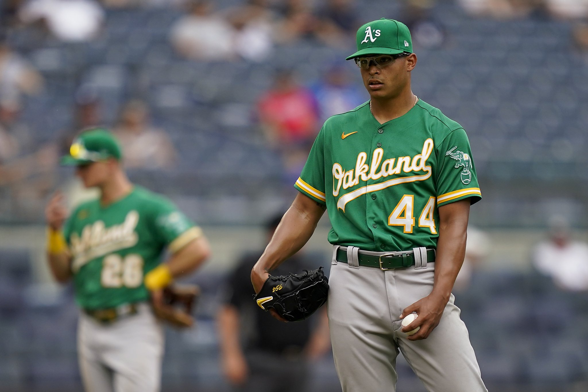Forced to reach deep, A's bullpen falters in late-innings loss to