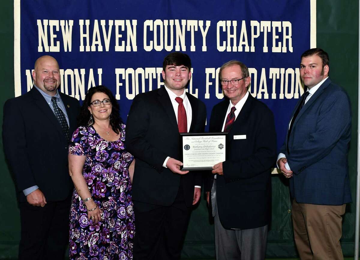Jonathan Law football player Anthony DiFederico with his parents John and Denise, scholar athlete chairman Kevin O'Brien and Law coach Christopher Haley was honored by the Casey-O'Brien New Haven County Chapter of the National Football Foundation and College Hall of Fame.