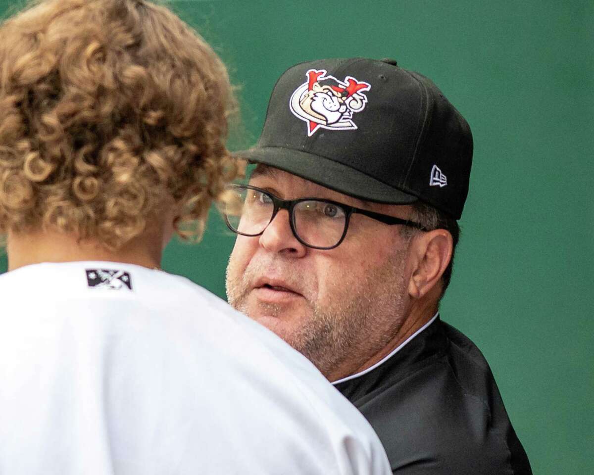 Tri-City ValleyCats manager Pete Incaviglia and Sussex County Miners  manager Bobby Jones, both former Major Leaguers, exchange lineup cards…