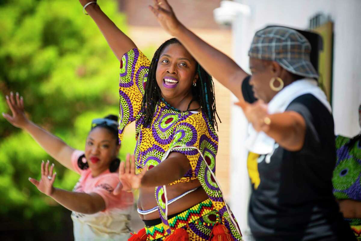 Alana Allen performs with KADDE, KoumanKele Africa Dance and Drum Ensemble, at a Juneteenth celebration at the historic DeLuxe Theater in Fifth Ward on Saturday, June 19, 2021.
