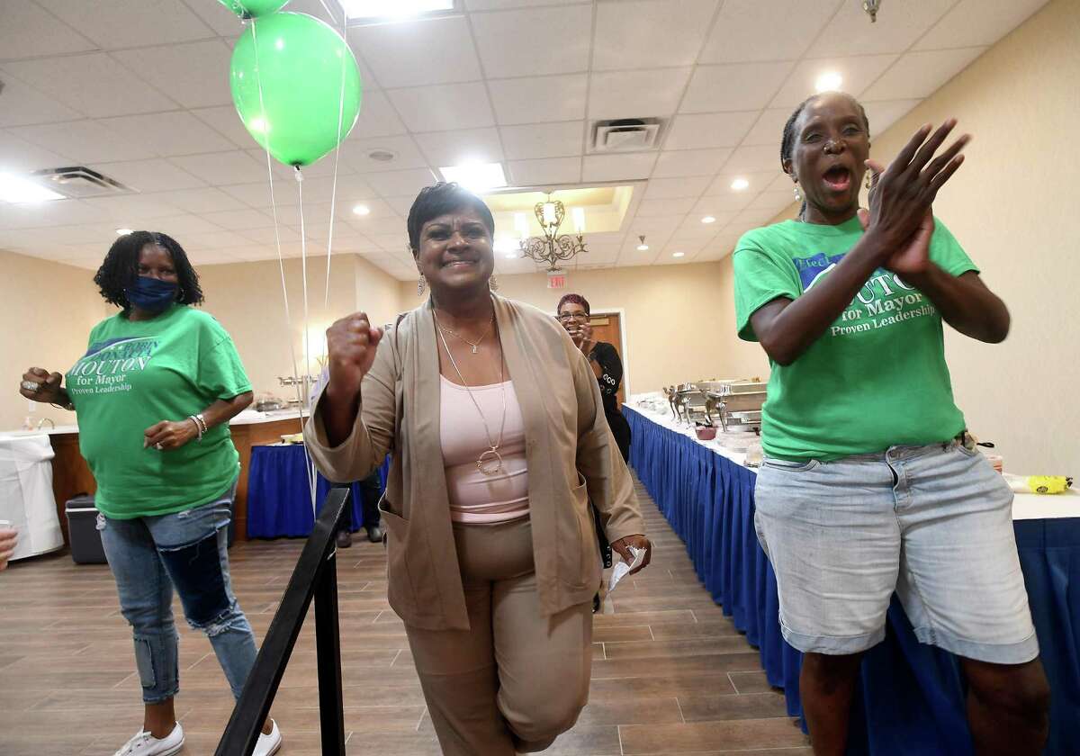 Robin Mouton celebrates with supporters, including her campaign manager Gwen Dalcour (right), at her watch party in Beaumont's mayoral run-off election Saturday. Photo made Saturday, June 19, 2021 Kim Brent/The Enterprise