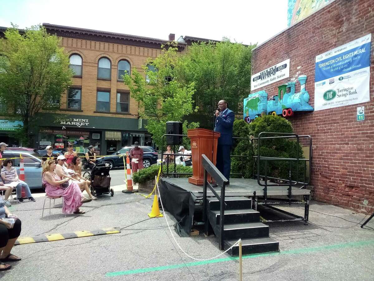 Juneteenth was celebrated on Water Street in Torrington Saturday. The gathering included speeches, music, African drumming, a ballet performance and the official unveiling of the MLK mural on the wall of the WAPJ building. Jacque Williams, founder of Culture4ACause, speaks during the event.