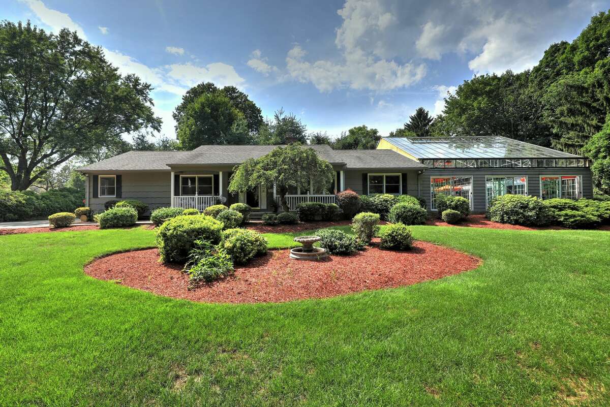 Milford ranch with glassenclosed indoor pool on the market for 595K