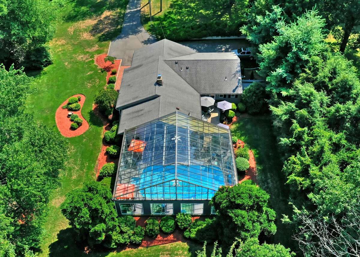 Milford ranch with glassenclosed indoor pool on the market for 595K