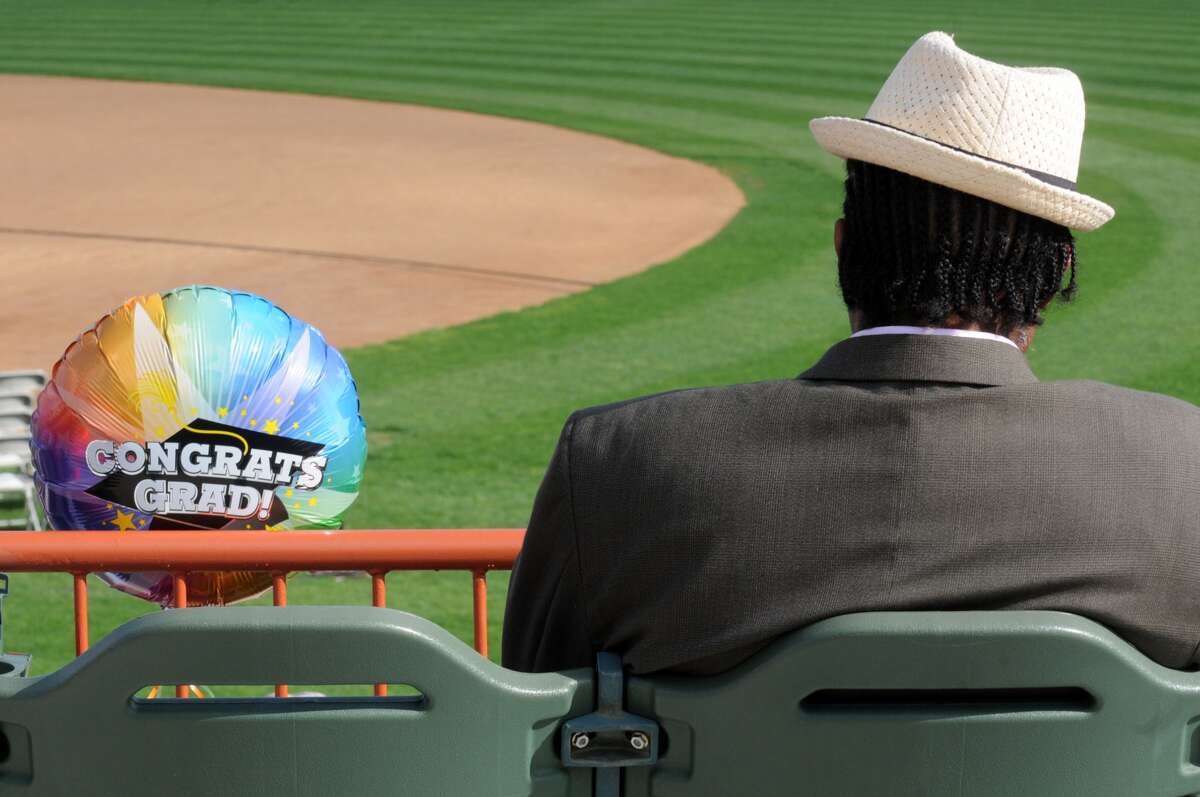 Mark Robinson, then a city of Albany 5th Ward councilman, waits to watch his daughter Markiea Robinson graduate with a political science degree during the Hudson Valley Community College commencement at Joseph L. Bruno Stadium in May 2014. (Michael P. Farrell/Times Union archive photo)