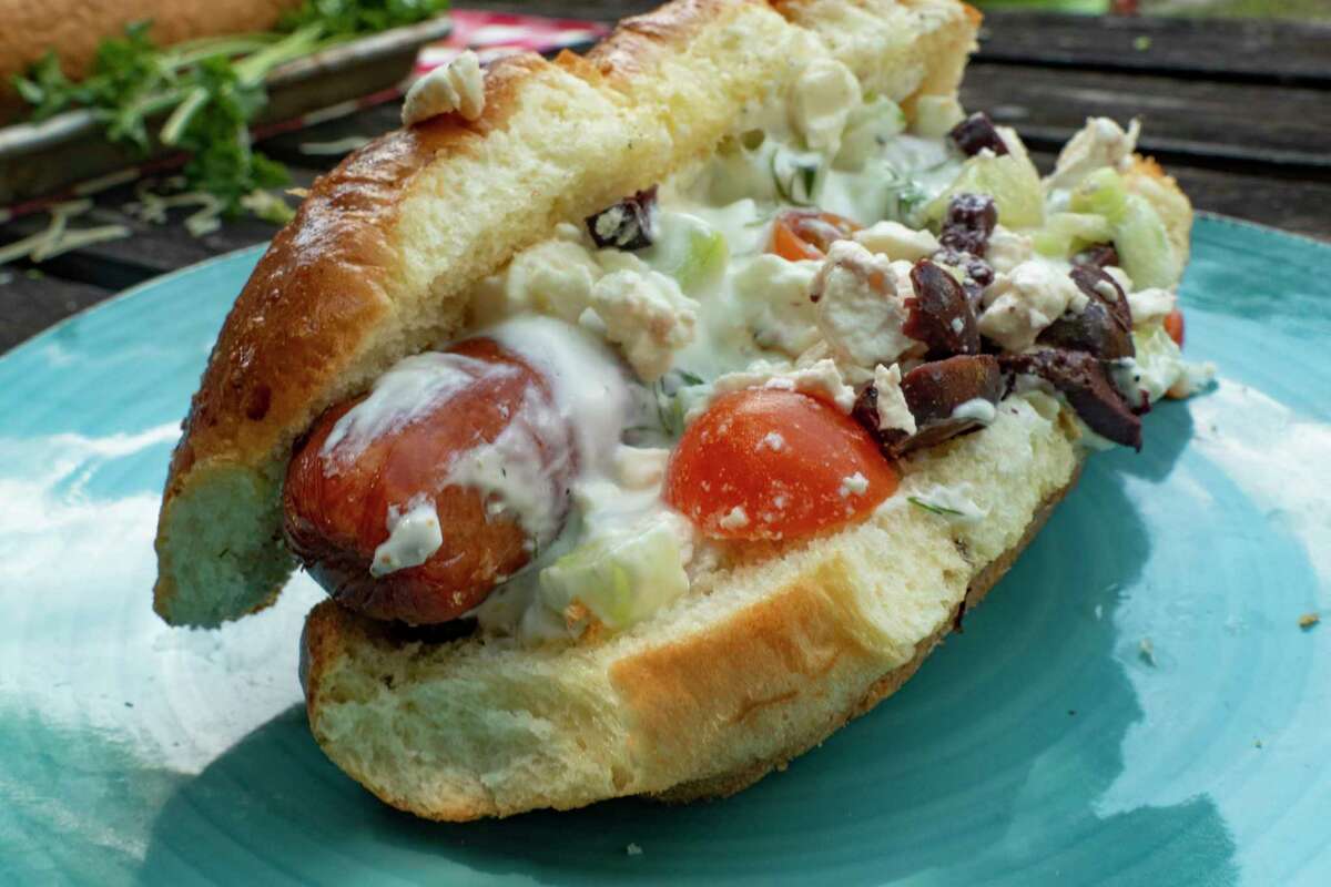 Greek Hot Dogs are a fun upgrade from the usual dog for Fourth of July cookouts.