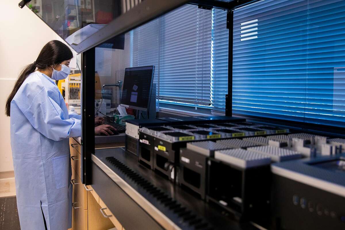 Lab technician Aamina Zahid works on sequencing COVID-19 samples at the Contra Costa County Public Health Lab in Martinez. Genomic sequencing finds that the delta coronavirus variant, which first emerged in India, is gaining a small but growing foothold in California.