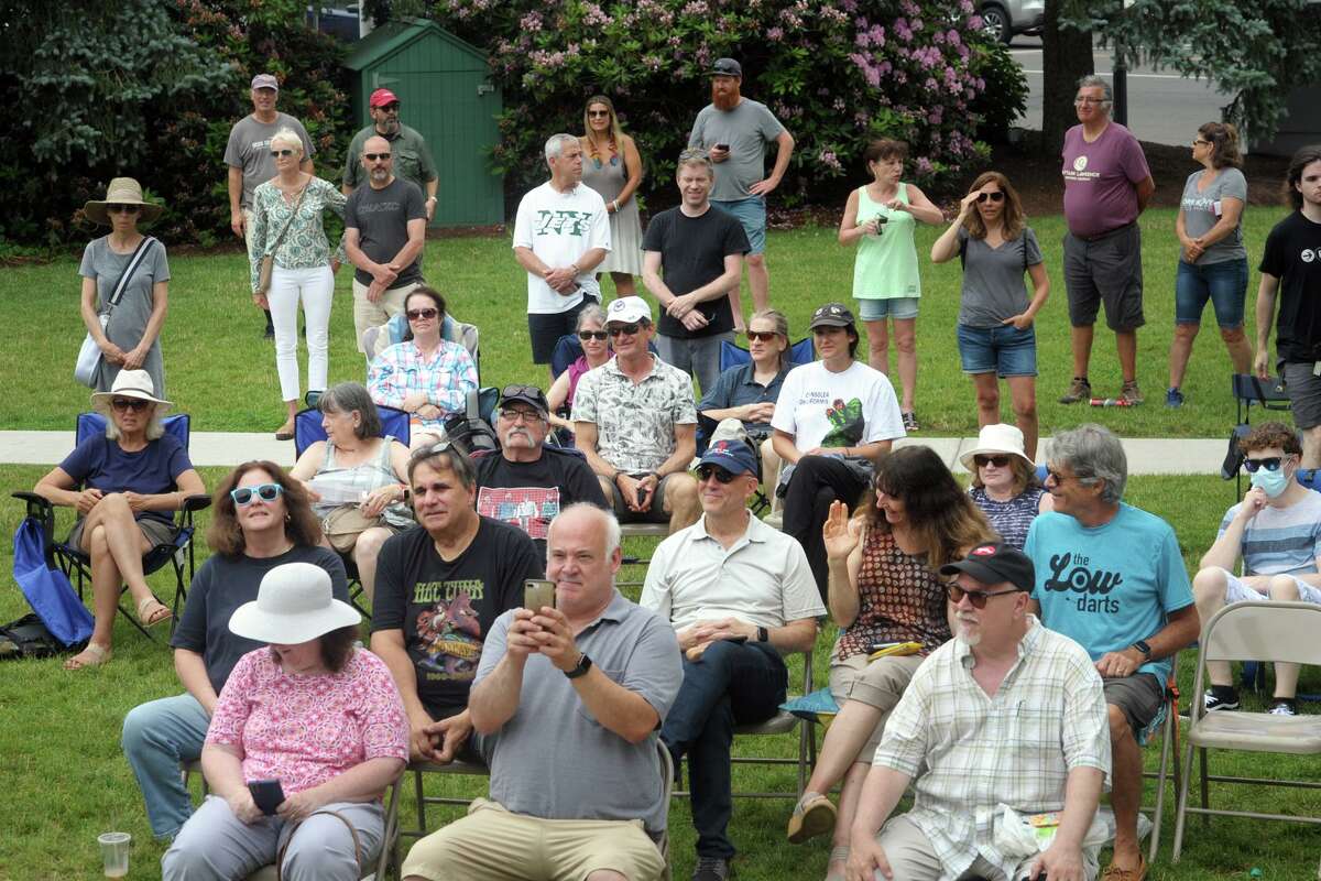 People gather around the gazebo on Sherman Green to listen to Make Music Day, in Fairfield, Conn. June 21, 2021.