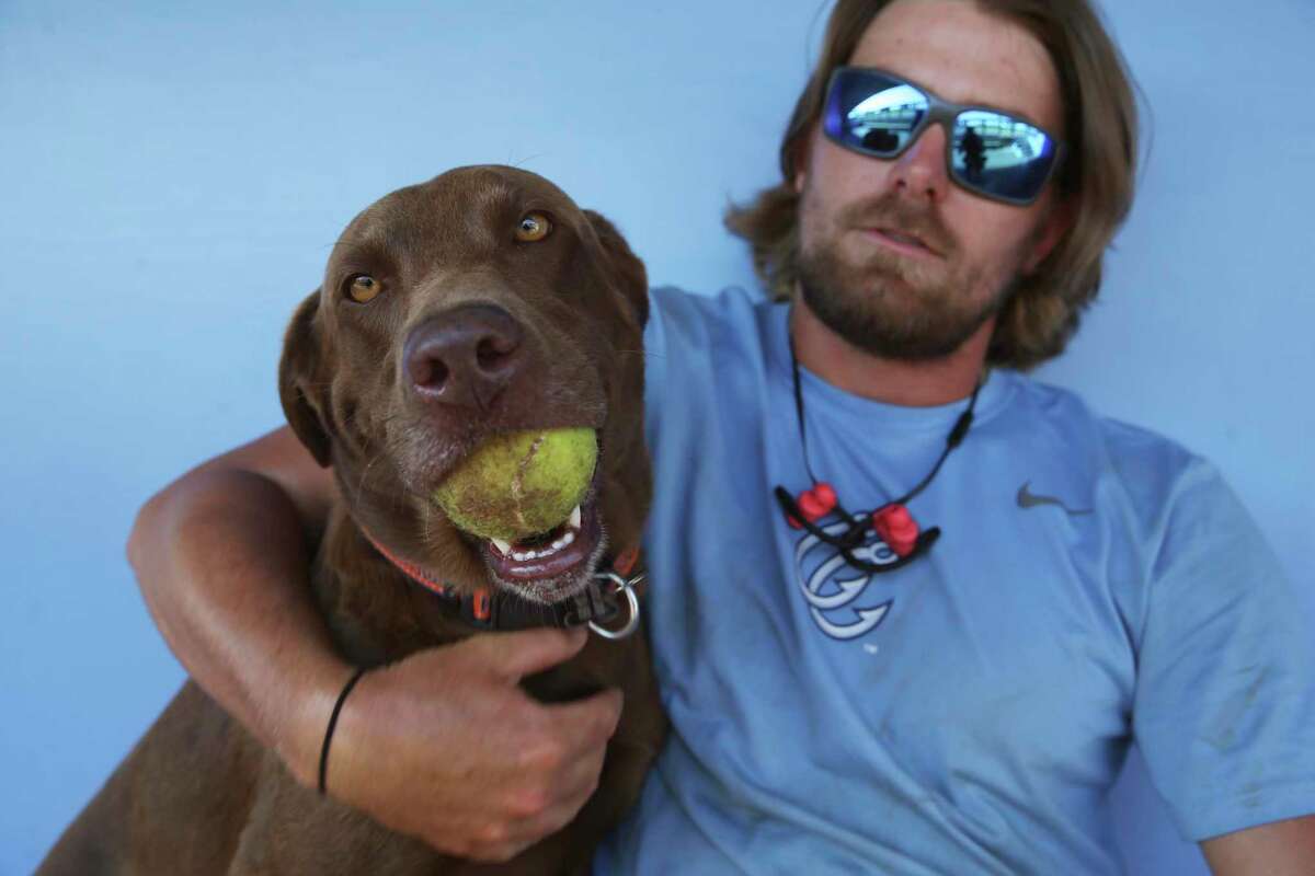 Quince Landry, the head groundskeeper for the Hooks, bought teal is a bird-hunting dog in Louisiana.