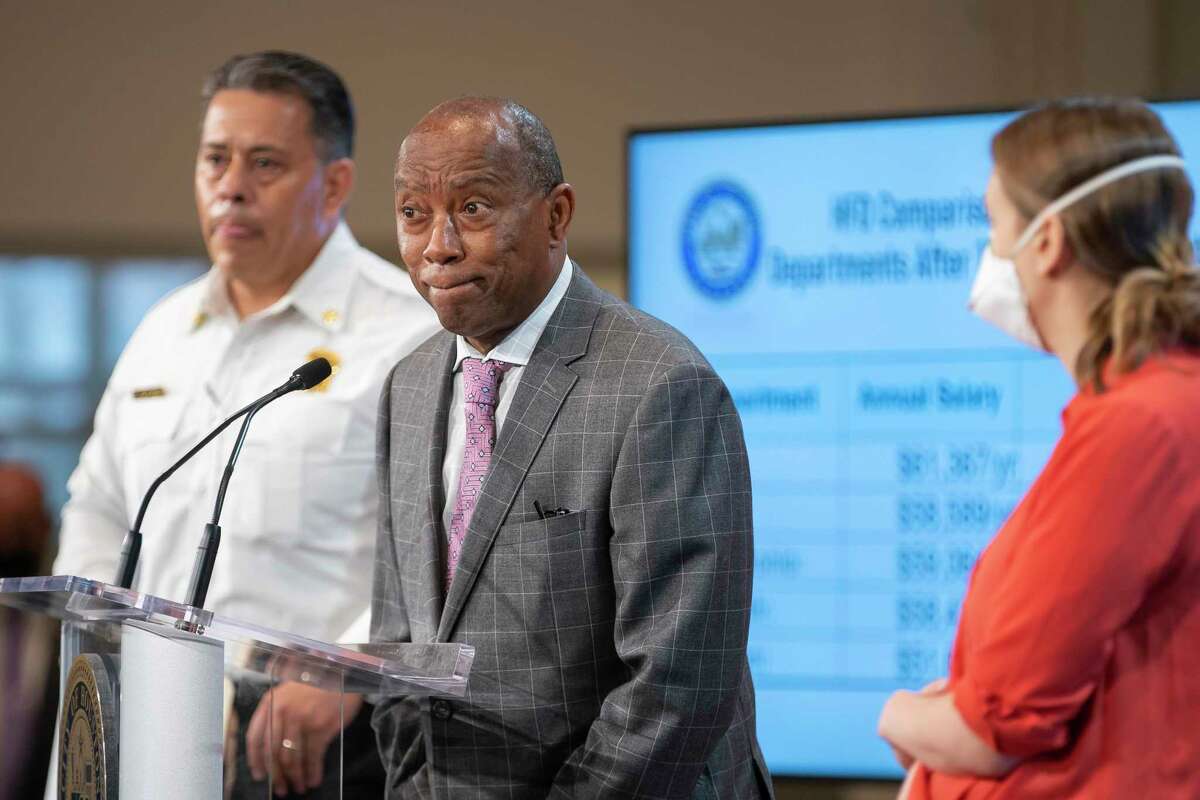 Houston Mayor Sylvester Turner answers questions from the media after announcing a pay raise for firefighters over the next three years using federal funds during a press conference with HFD Chief Samuel Peña, Wednesday, May 19, 2021, at City Hall in Houston.
